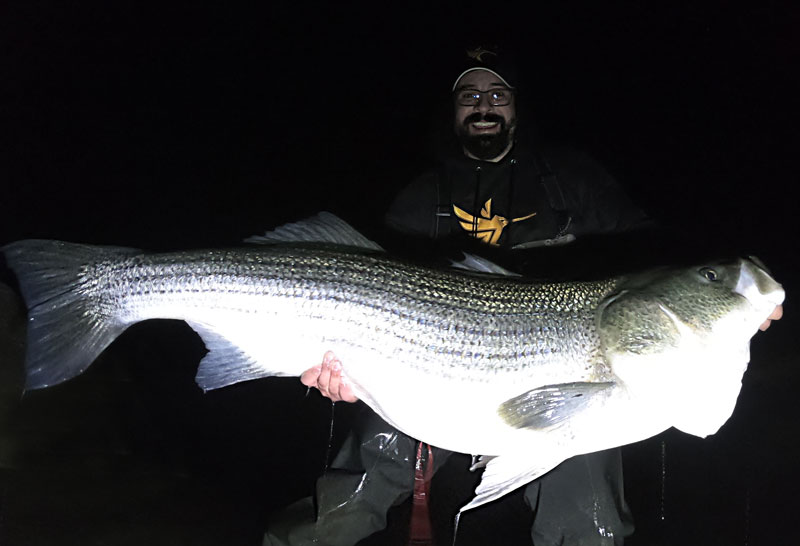 alan battista with a big striper