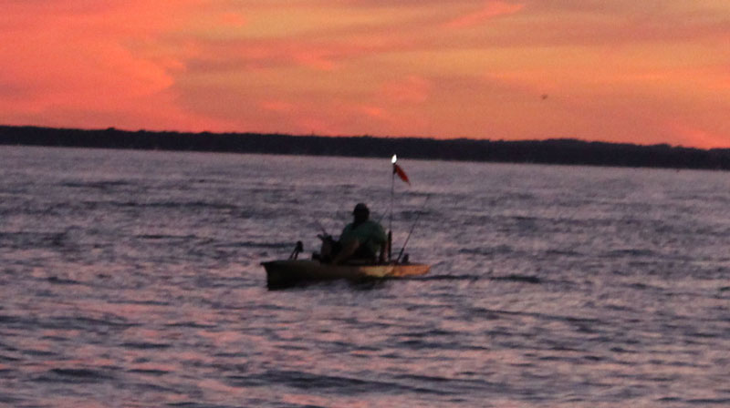 lighted kayak fishing in the bay