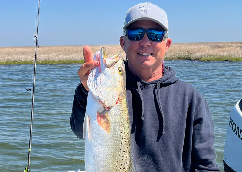 pete holding a big speckled sea trout