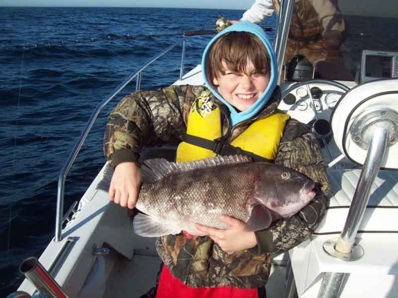 young angler winter fishing