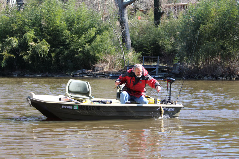 fishing in muddy tributary water