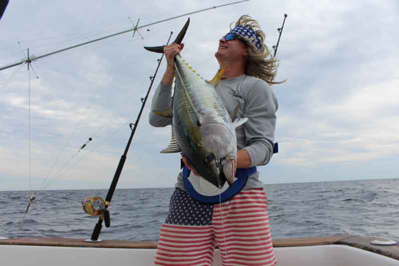 angler with yellowfin tuna